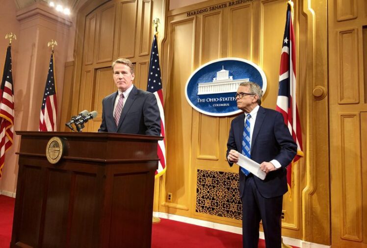 Lt. Gov.-elect Jon Husted, left, speaks at a Tuesday, Jan. 8 2019 news conference in Columbus announcing his official duties